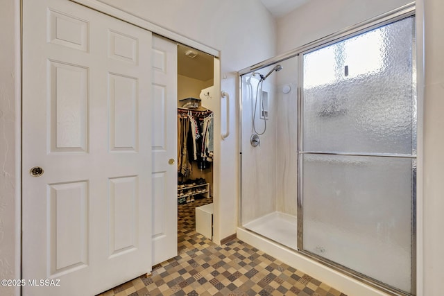 bathroom with a shower with shower door