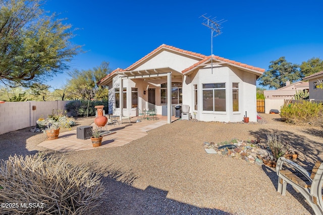 back of house featuring a patio area