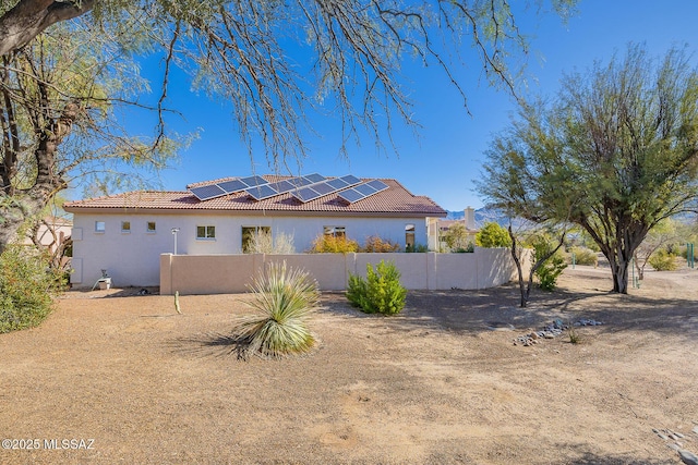 view of home's exterior featuring solar panels