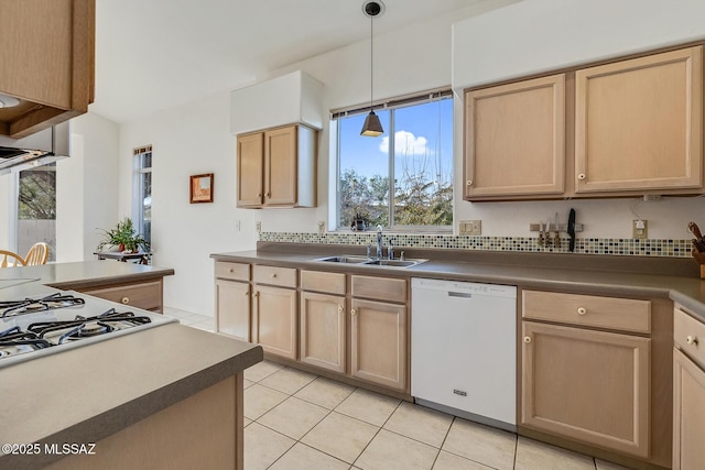 kitchen with sink, dishwasher, light tile patterned flooring, decorative light fixtures, and light brown cabinets