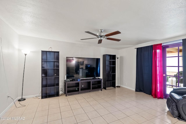 tiled living room featuring a textured ceiling and ceiling fan