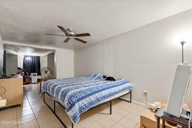 tiled bedroom with ceiling fan