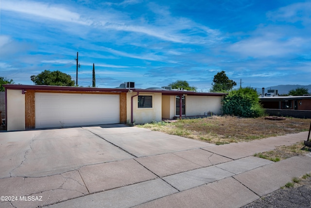 single story home with a garage