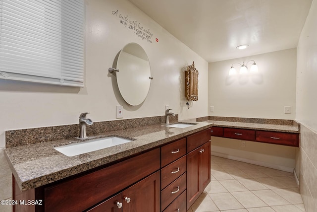 bathroom with a sink, tile patterned flooring, and double vanity