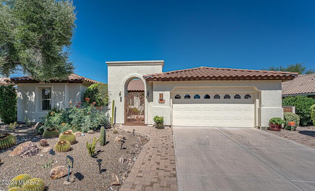 mediterranean / spanish-style house featuring a garage