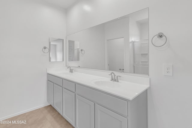 bathroom with tile patterned floors and vanity