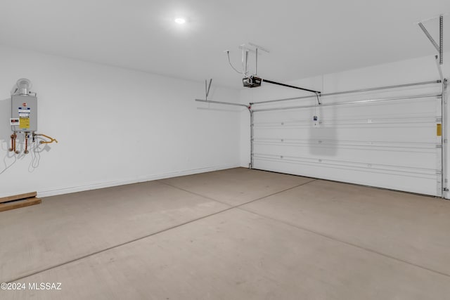 garage with a garage door opener and water heater