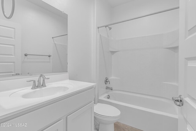 full bathroom featuring vanity, shower / bath combination, and toilet