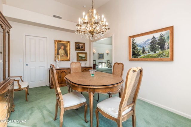 carpeted dining space with lofted ceiling and a notable chandelier