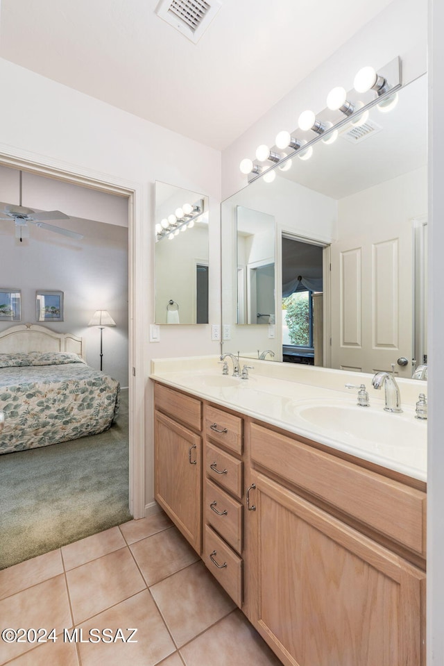 bathroom featuring vanity, ceiling fan, and tile patterned floors