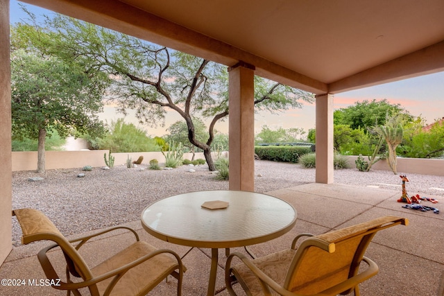 view of patio terrace at dusk