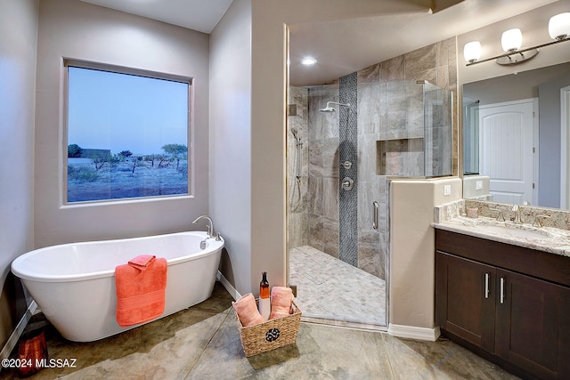 bathroom featuring vanity and plus walk in shower