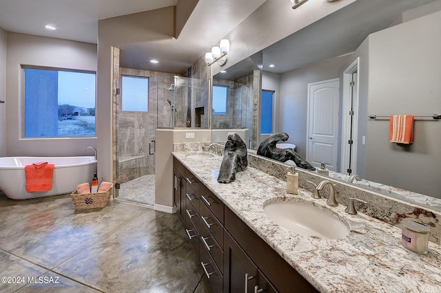 bathroom with vanity, a wealth of natural light, separate shower and tub, and concrete flooring