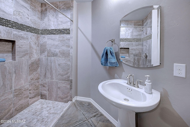 bathroom with a tile shower