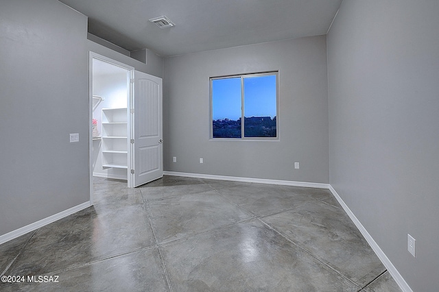 empty room featuring concrete floors