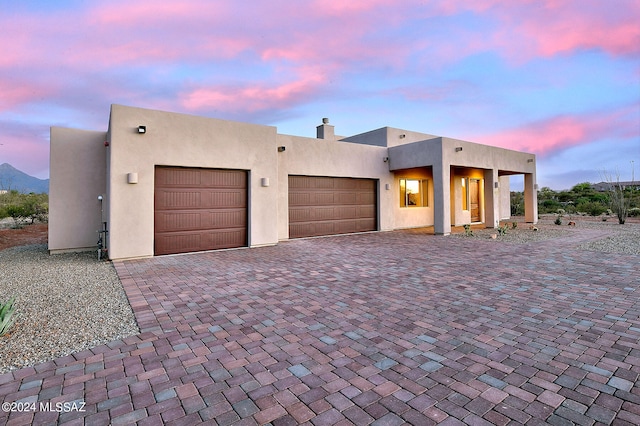 adobe home featuring a garage