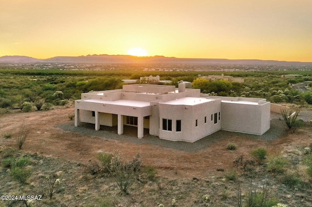 aerial view at dusk with a mountain view