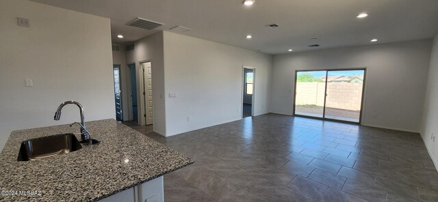 kitchen with sink and stone counters