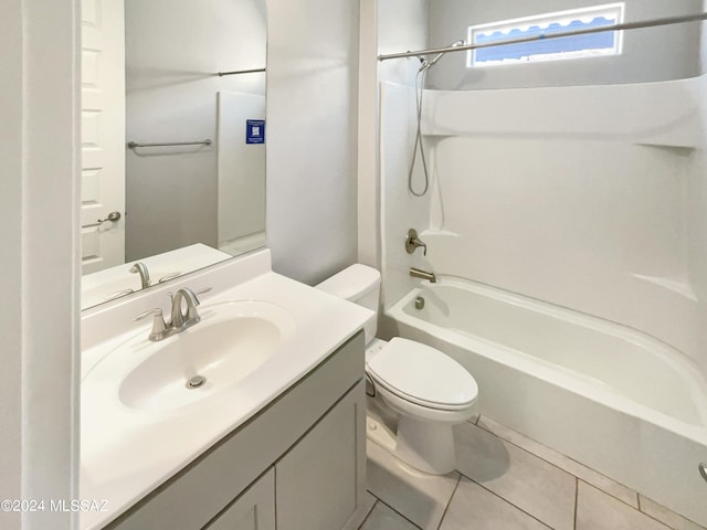 full bath featuring toilet, tile patterned flooring, shower / washtub combination, and vanity