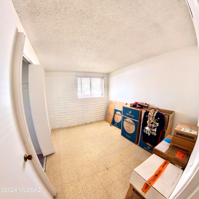 basement with a textured ceiling