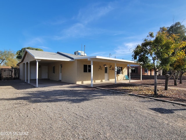 view of front of property featuring a carport