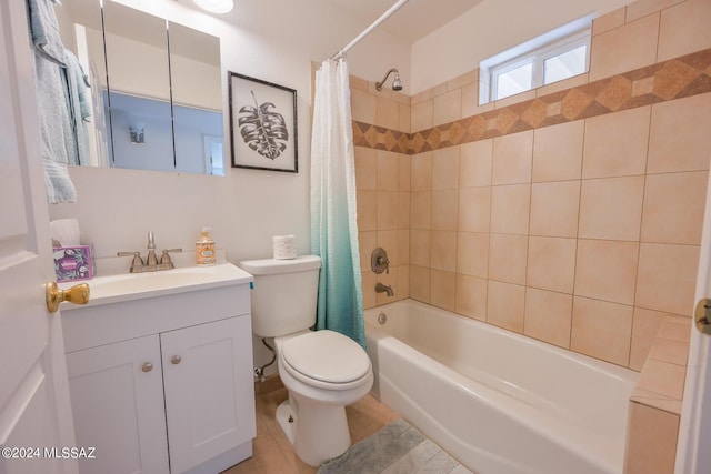 full bathroom featuring vanity, toilet, and shower / tub combo with curtain