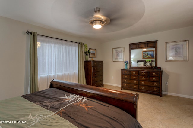 bedroom featuring ceiling fan and light tile patterned floors