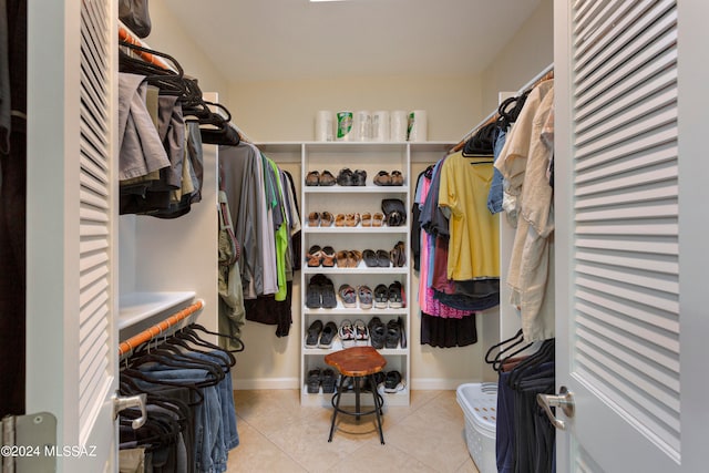 spacious closet featuring light tile patterned flooring