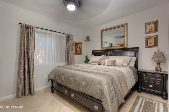 bedroom with light tile patterned flooring and ceiling fan