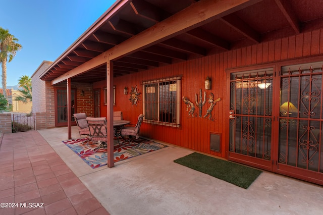 view of patio terrace at dusk