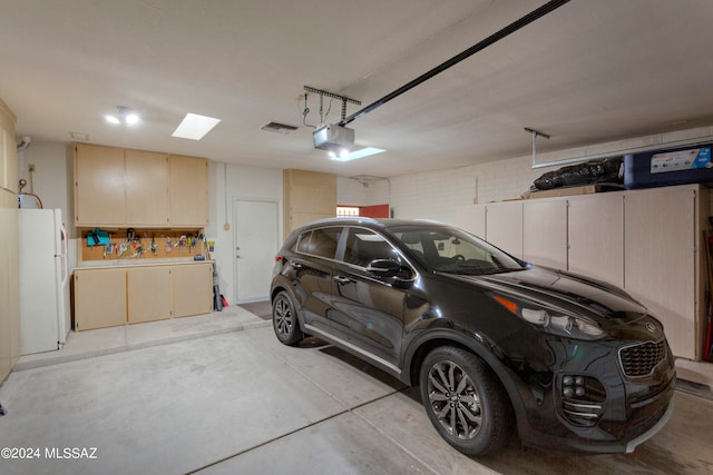 garage featuring white refrigerator