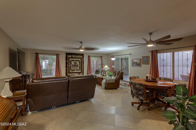 living room with light tile patterned flooring and ceiling fan