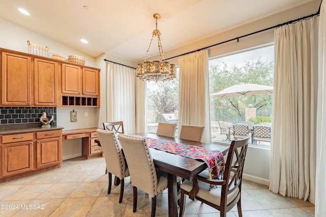 dining room featuring light tile patterned floors and a notable chandelier