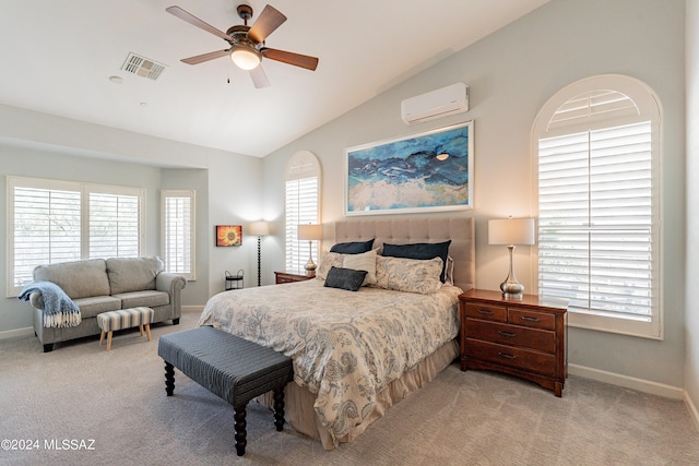 bedroom with a wall mounted AC, ceiling fan, light carpet, and vaulted ceiling