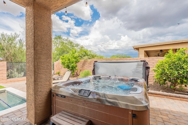 view of patio with a hot tub