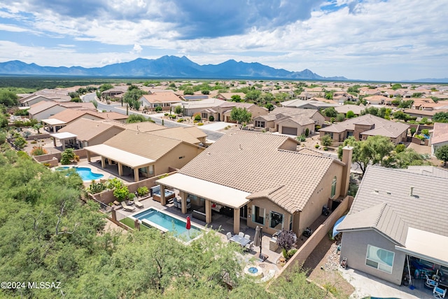 drone / aerial view featuring a mountain view