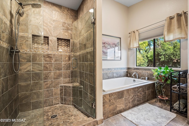 bathroom featuring shower with separate bathtub