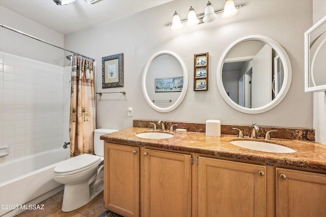 full bathroom with tile patterned floors, toilet, shower / tub combo, and vanity