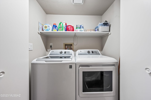 laundry area featuring washer and clothes dryer