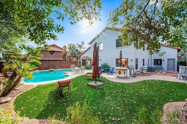 exterior space with a lawn and a patio area