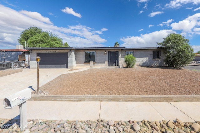 ranch-style house featuring a garage