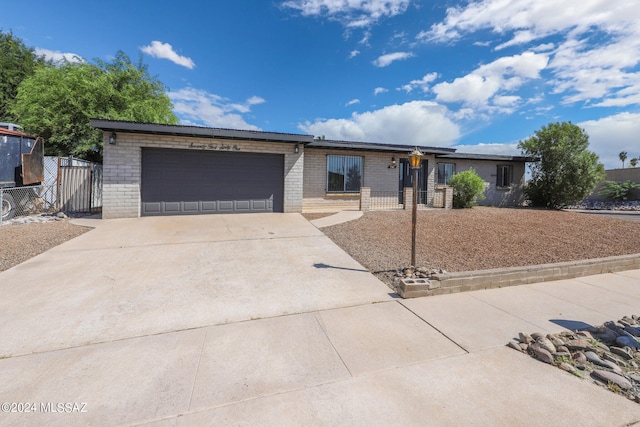 single story home with a garage