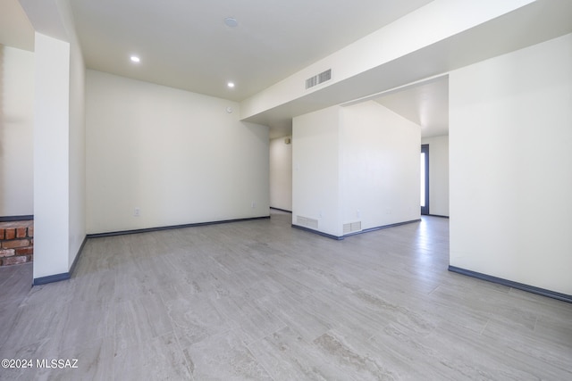 unfurnished room with light wood-type flooring