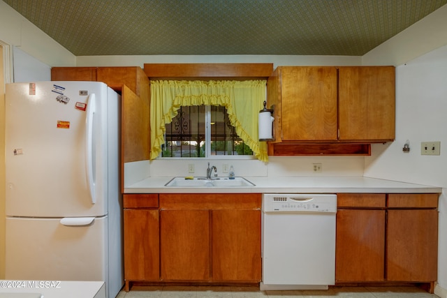 kitchen with sink and white appliances