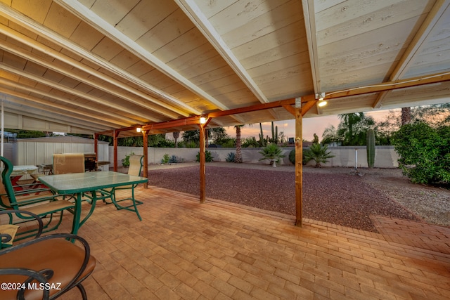 view of patio terrace at dusk