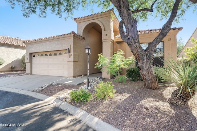 view of front of home with a garage