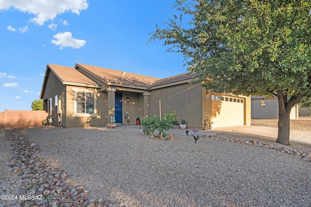 single story home with a garage