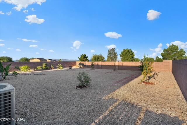 view of yard with central AC