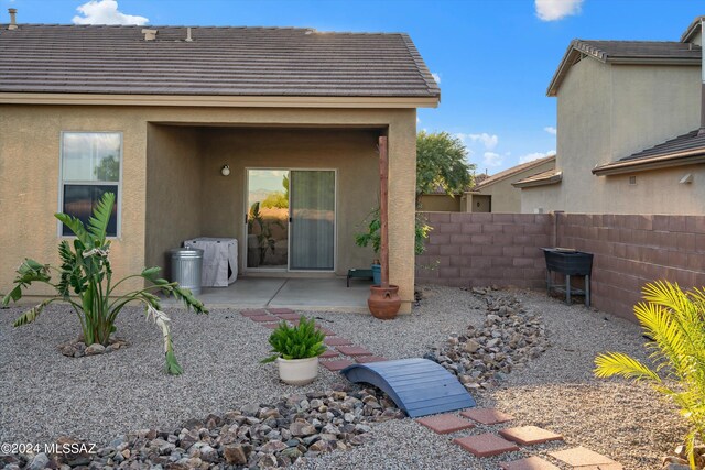 back of property featuring a patio area