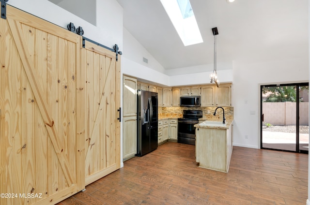 kitchen featuring high vaulted ceiling, stainless steel appliances, decorative light fixtures, and dark hardwood / wood-style flooring